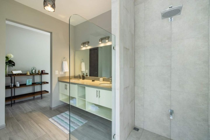 a room with a sink and a mirror