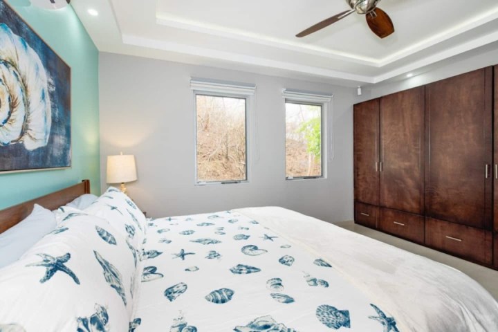 a bedroom with a bed in a room