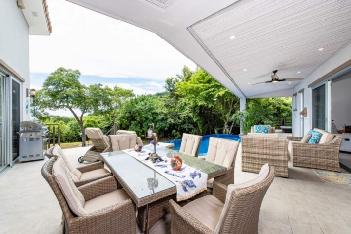 a living room filled with furniture and a fireplace