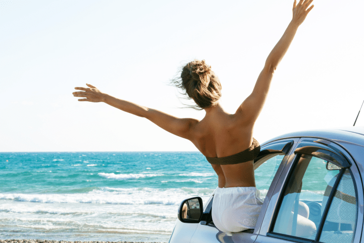 a person playing frisbee on the beach