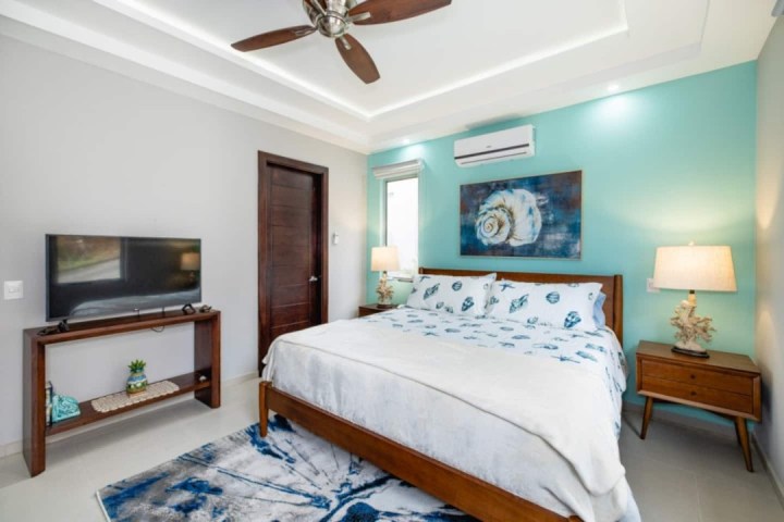 a bedroom with a bed in a room