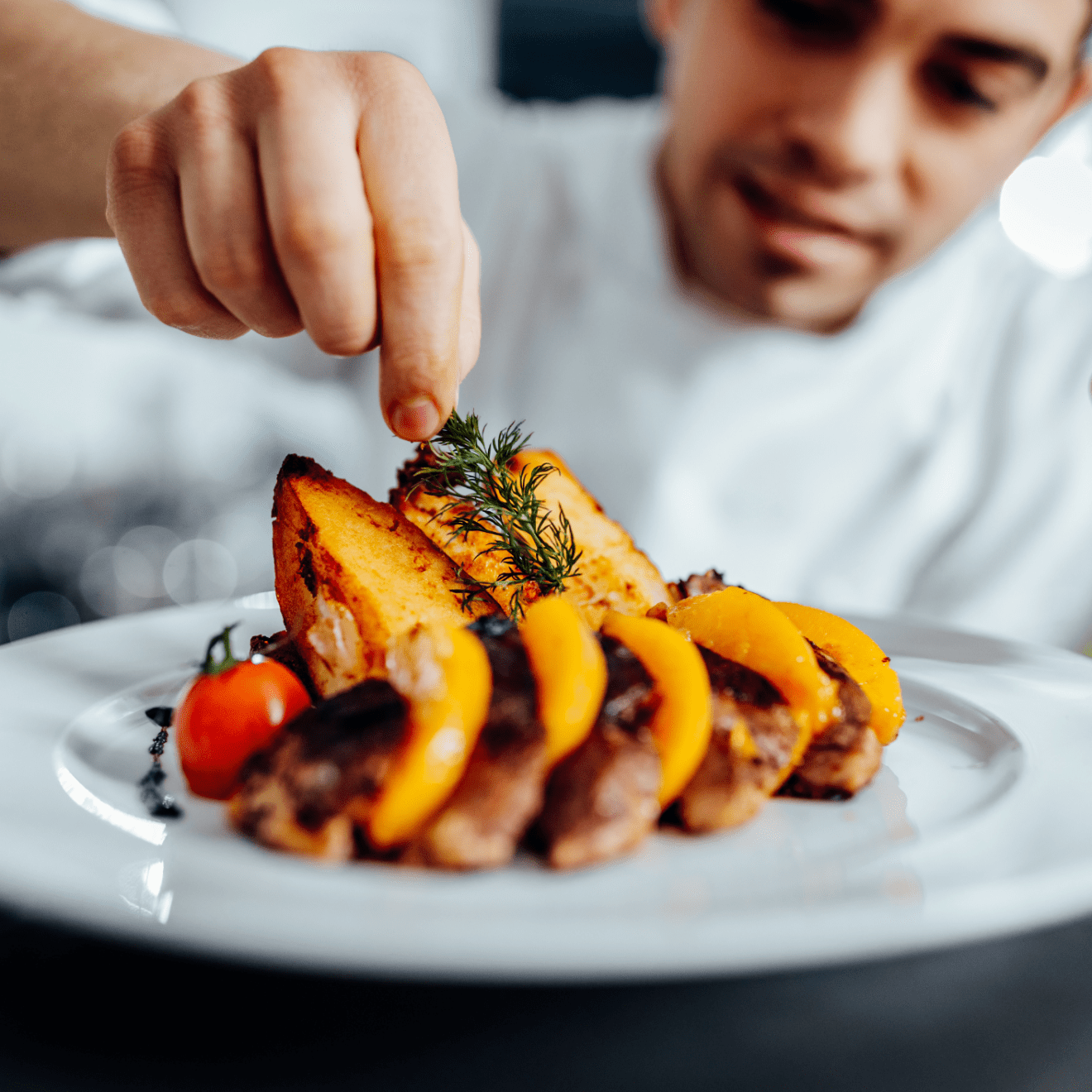 a person that is eating some food on a plate