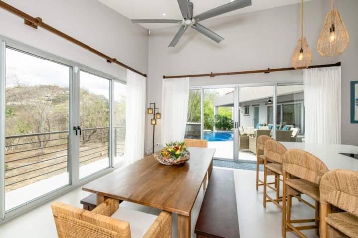 a dining room table in front of a window