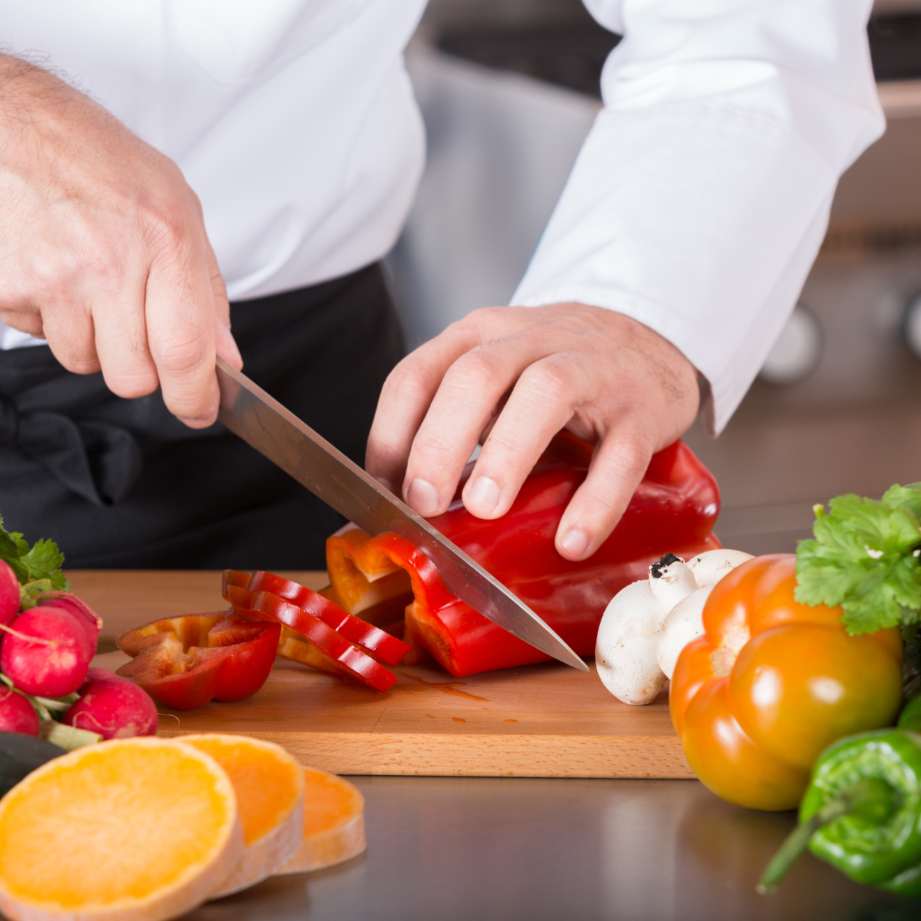 a person cutting food on a table