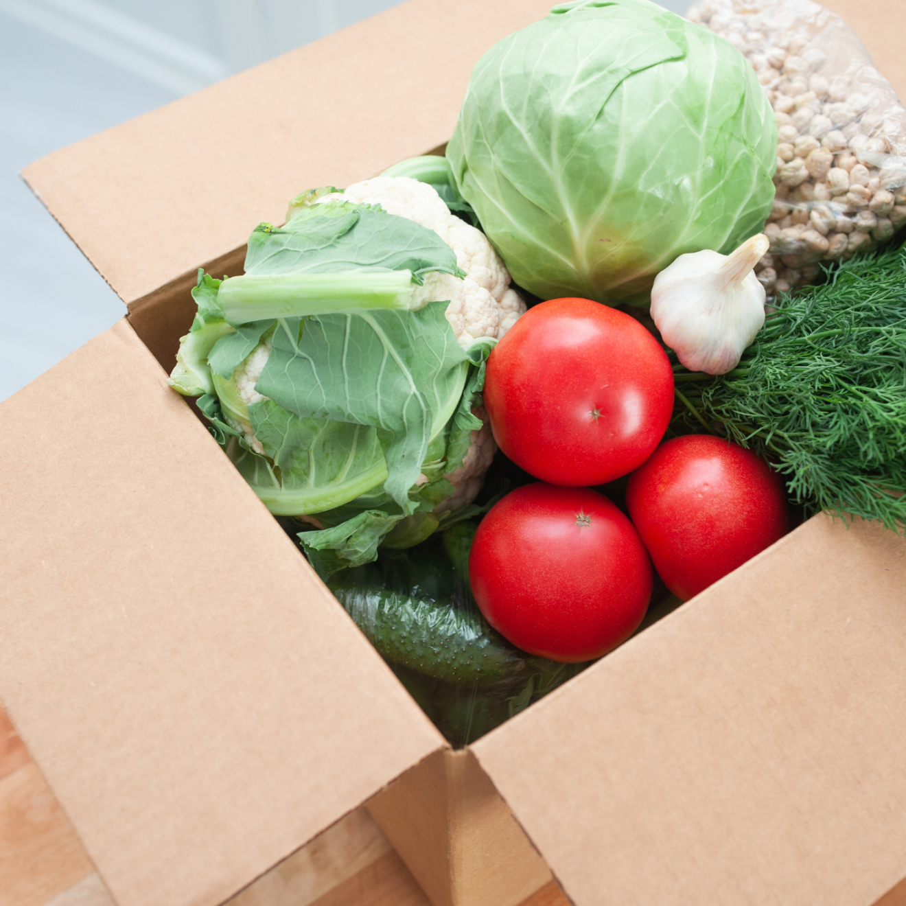 a box filled with different types of food on a table