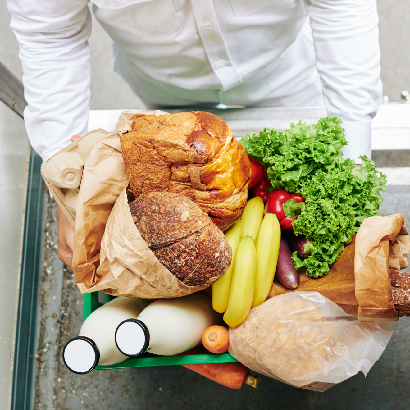 a person holding a plate of food