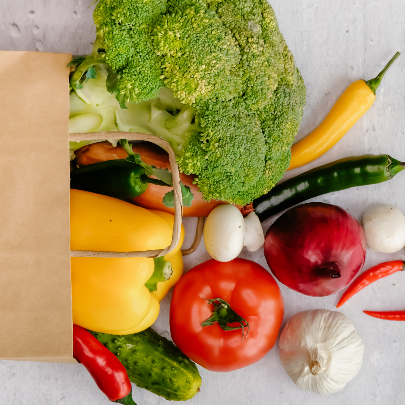 a box of fruit and vegetable salad