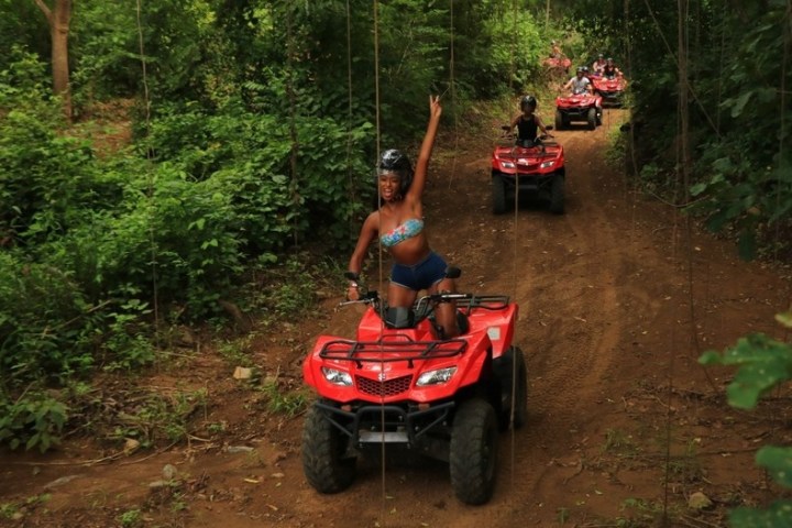 a person riding a bike down a dirt road