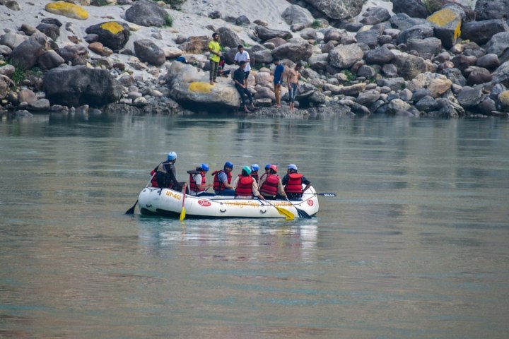 a group of people on a boat in the water