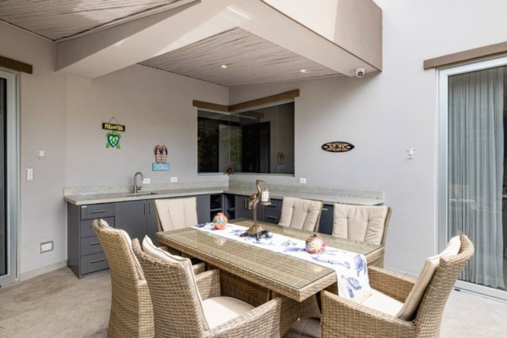 a living room filled with furniture and a large window