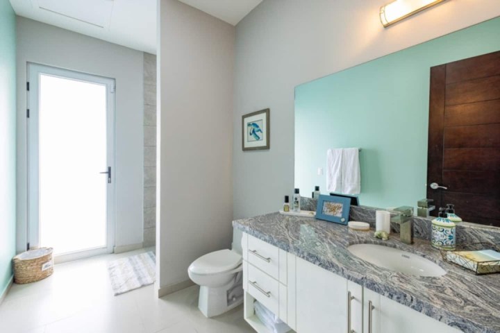 a kitchen with a sink and a mirror