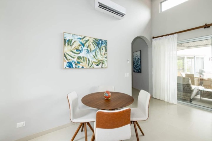 a room filled with furniture and a large window