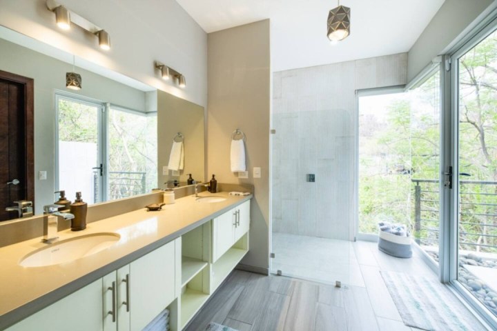 a double sink and large mirror