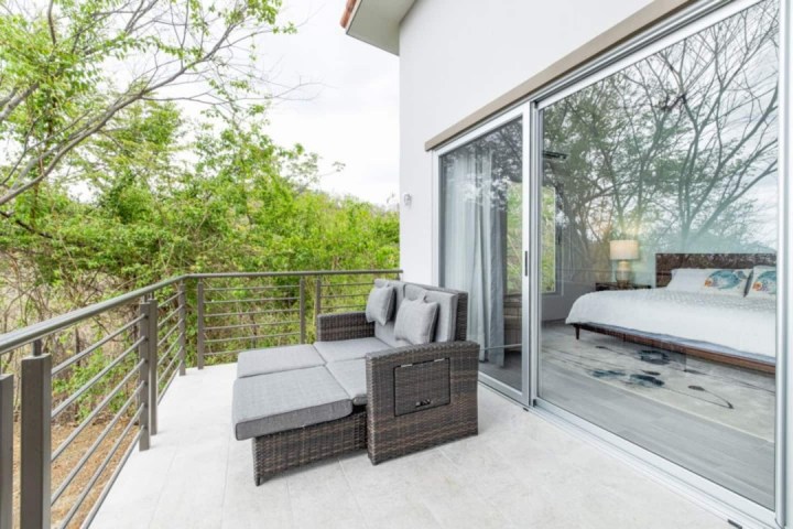 a bedroom with a wooden fence