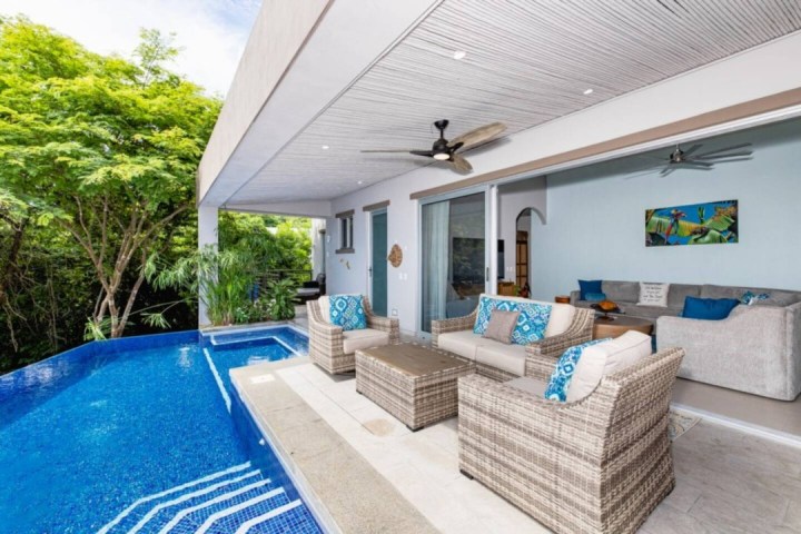 a living area with a building in the background