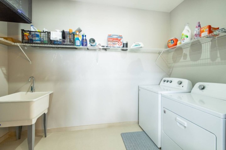 a kitchen with a sink and a mirror