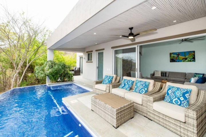 a room with a pool in front of a building