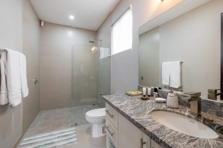 a double sink and large mirror