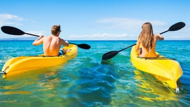 a person riding a surf board on a body of water