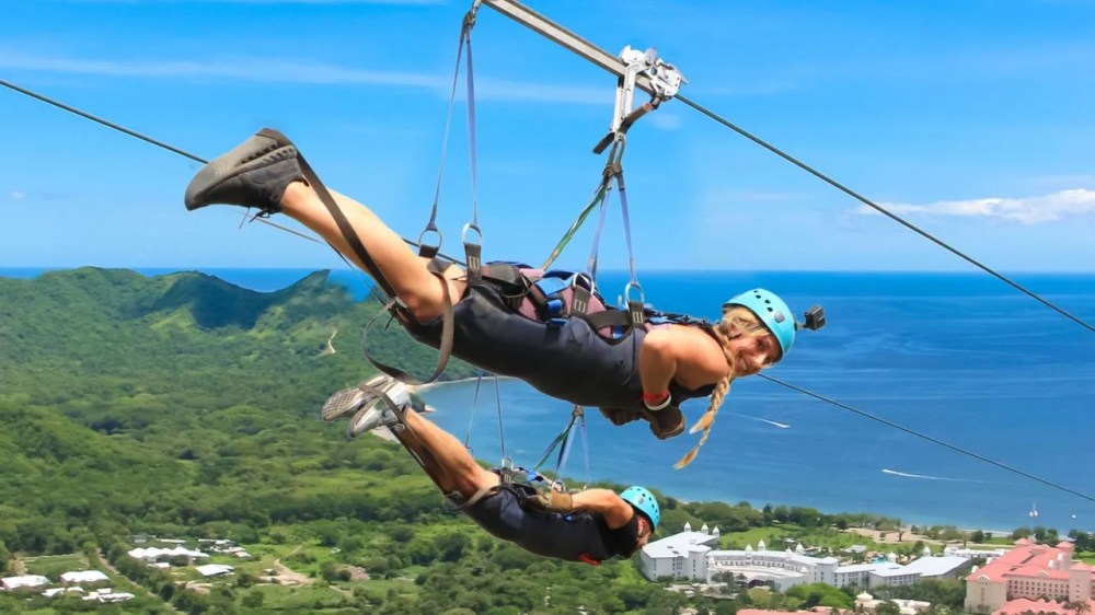 a person in a swing in a body of water