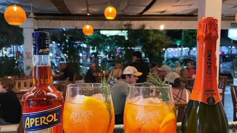 a bottle and a glass of orange juice
