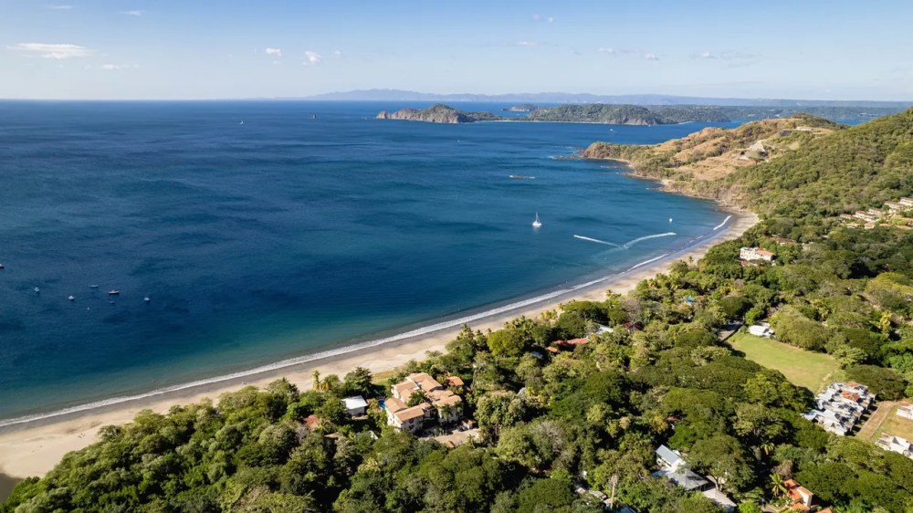 a view of a beach next to a body of water