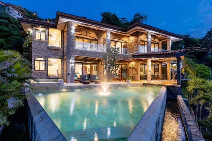 a house with trees in the background