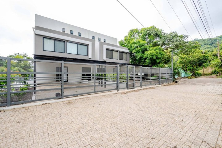 a train is parked on the side of a building