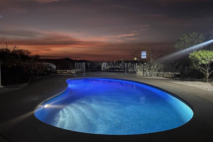 a pool next to a body of water