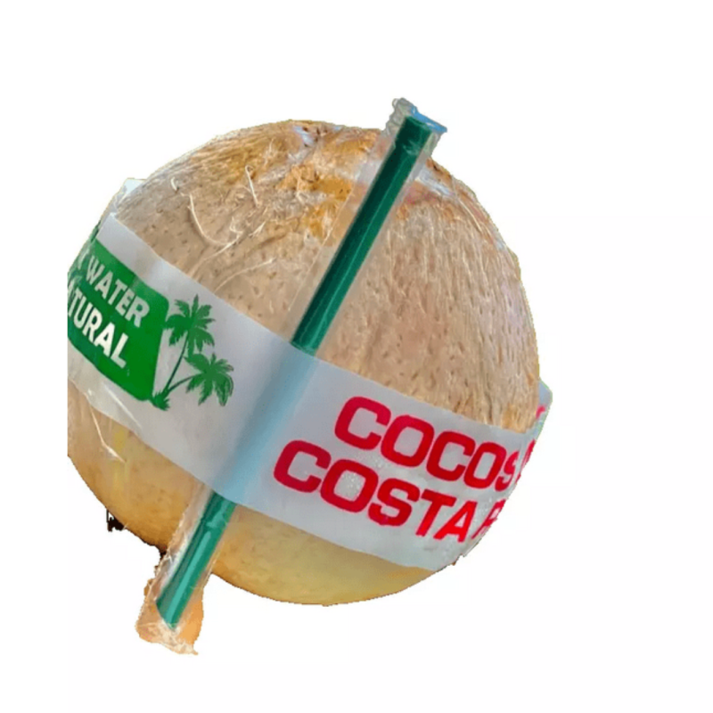 Whole coconut wrapped in labels with a straw inserted.