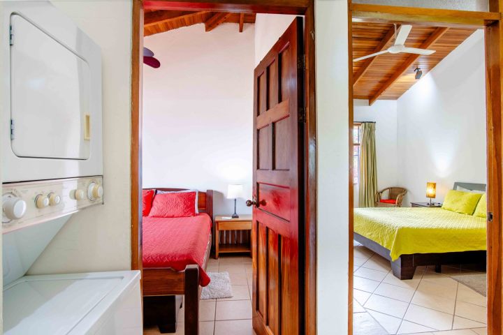 Interior view showing two bedrooms and a laundry area.